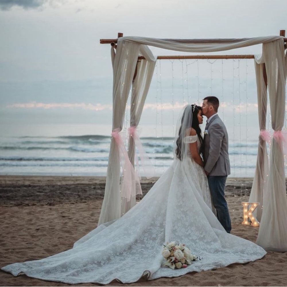 Elegant Mia Solano Wedding dress with subtle shimmer